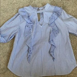 Blue and white striped shirt with ruffles.